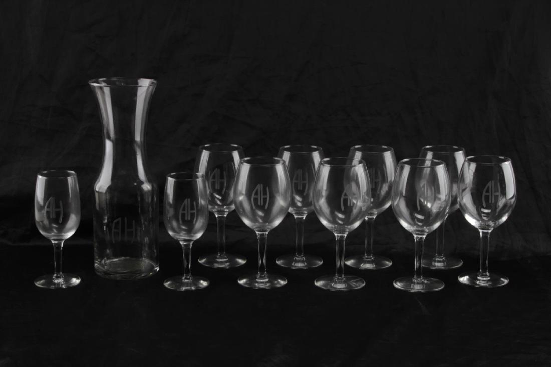 ADOLF HITLER ETCHED STEMWARE GLASSES & DECANTER: 11 pieces total: one decanter measures 11 inches tall, 2 small white wine glasses measure 6 1/8 inches tall, and 8 regular wine glasses measure 7 inches tall. Very good condition. CSG32