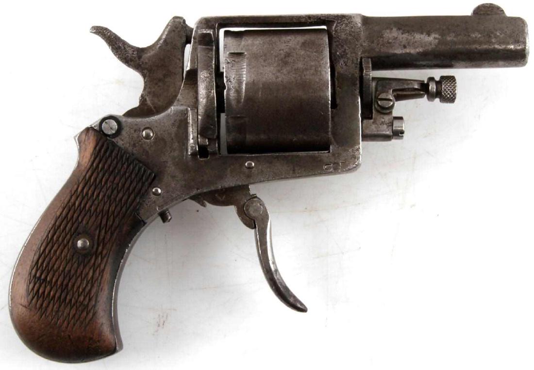 ANTIQUE GERMAN BULLDOG REVOLVER FOLD TRIGGER 32: 1890's production. 6 shot revolver in .32 CF with 2 inch barrel, fair bore. Steel has some pitting, double crown over U proof mark to right side frame, serial no. 2 marked to cylinder, half moon piece