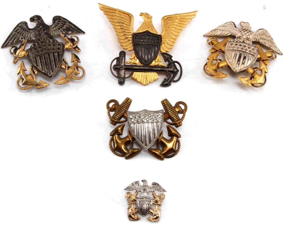WWII US NAVY COAST GUARD OFFICER BADGE LOT OF 5: This lot contains a variety of WWII US Navy and US Coast Guard hat badges and includes: 1 US Navy 24k gold plate screw-back officer hat badge, 1 US Navy Sterling and gold screw-back badge, 1 US Navy V