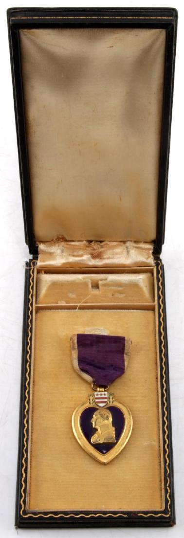 WWII US ARMY 1945 CASED NAMED PURPLE HEART: Purple Heart medal in case named to Michael Popp and dated Jan. 16, 1945. Medal is in very good condition, lining of the case has some wear.