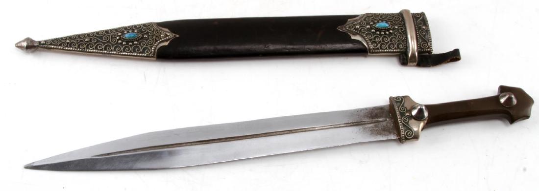 VINTAGE TO ANTIQUE FULLERED BLADE ARABIAN DAGGER: Vintage to Antique Fullered blade Arabian gladius style dagger with thin and deep fuller with double edged blade. Decorated locket and pommel with one stud on each. Scabbard is highly decorated with i
