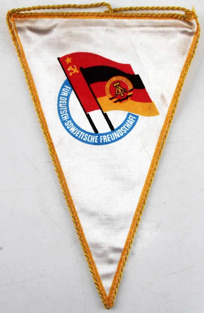 USSR SOVIET & EAST GERMAN SILK PENNANT FLAG: Measuring 10 by 7 inches, silk and gold bordered pennant with string for hanging. F140