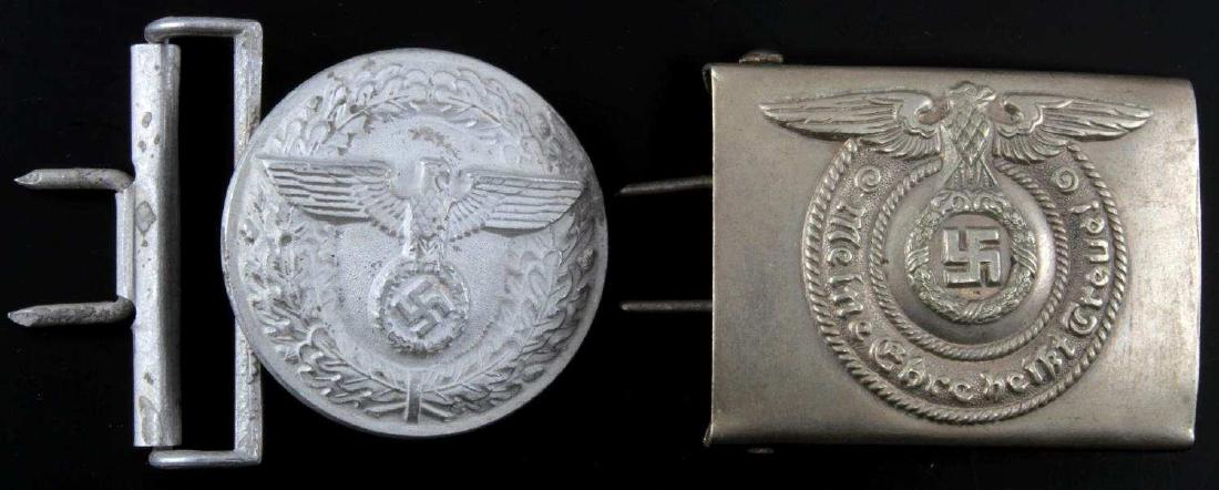 WWII GERMAN THIRD REICH WAFFEN SS BELT BUCKLE LOT: This lot includes 2 WWII German aluminum belt buckles including 1 "Meine Ehre heisst treue!" Waffen SS buckle and 1 RZM stamped "M4/24" reichsadler/oak wreath buckle. Buckles are in excellent conditio