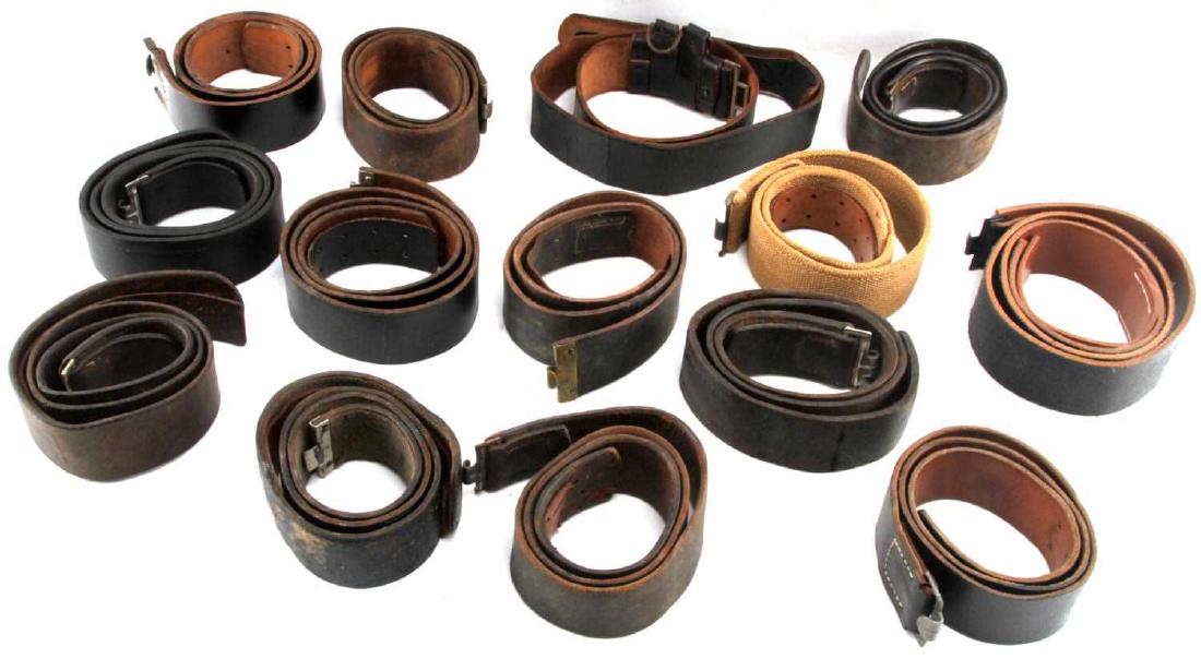 WWII GERMAN THIRD REICH WEHRMACHT BELT LOT OF 15: This lot includes 15 WWII Wehrmacht belts in various sizes. Except for 1, all belts are leather and many are stamped with the size in CM at their ends. 1 belt is made of cloth and is a D.A.K. Afrika K