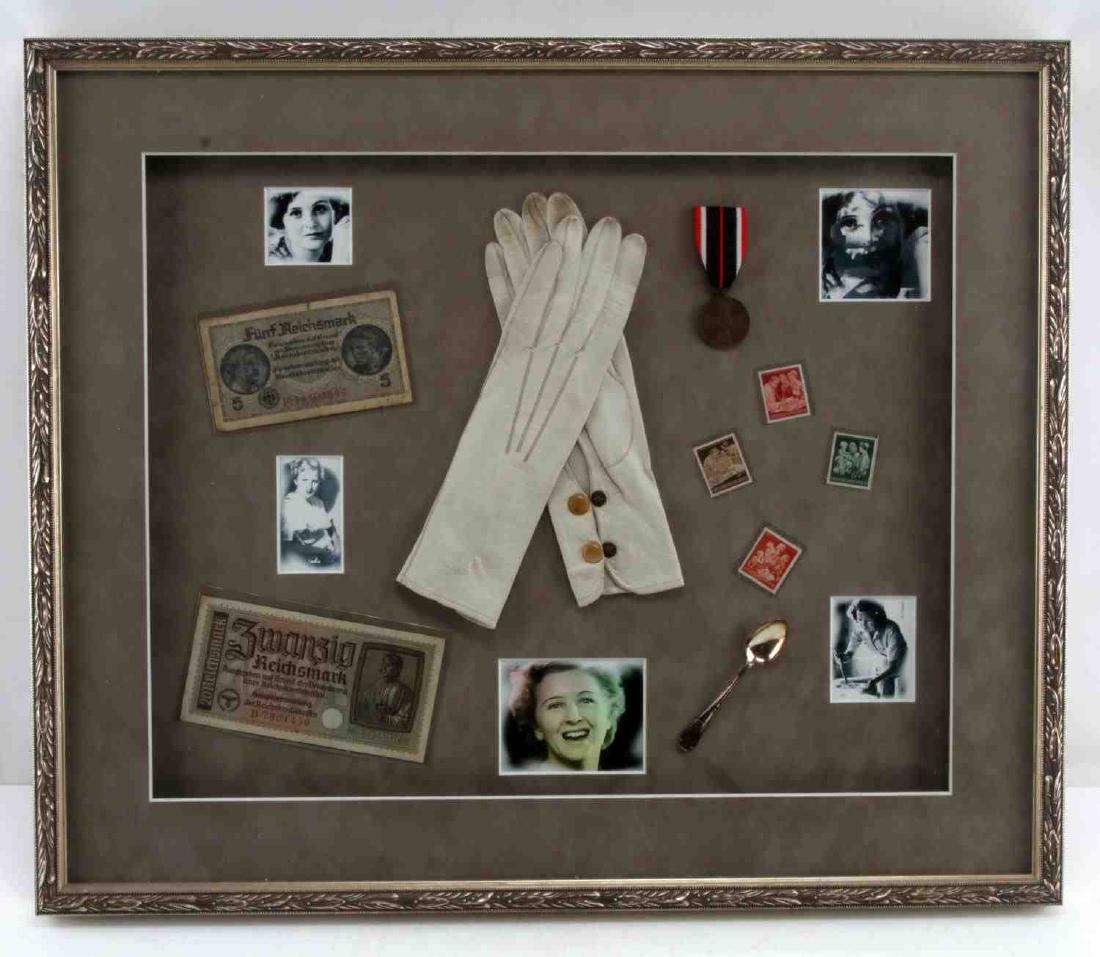 WWII EVA BRAUN COLLECTION W MONOGRAMMED GLOVES: This is a 25 X 21" framed display case containing an Eva Braun "EB Butterfly" monogrammed silver spoon and Eva Braun's personal "EB Butterfly" monogrammed gloves. The case also contains German Reichsm