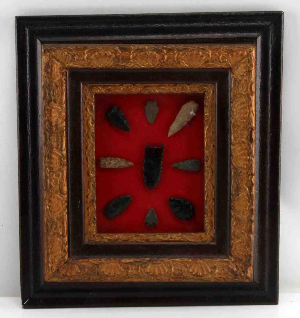 FRAME OF 9 PALEO & ARCHAIC ARROWHEAD LOT: Wood frame measures 20 by 18 inches, points 1.5 to 3 inches. Unauthenticated sold as is.