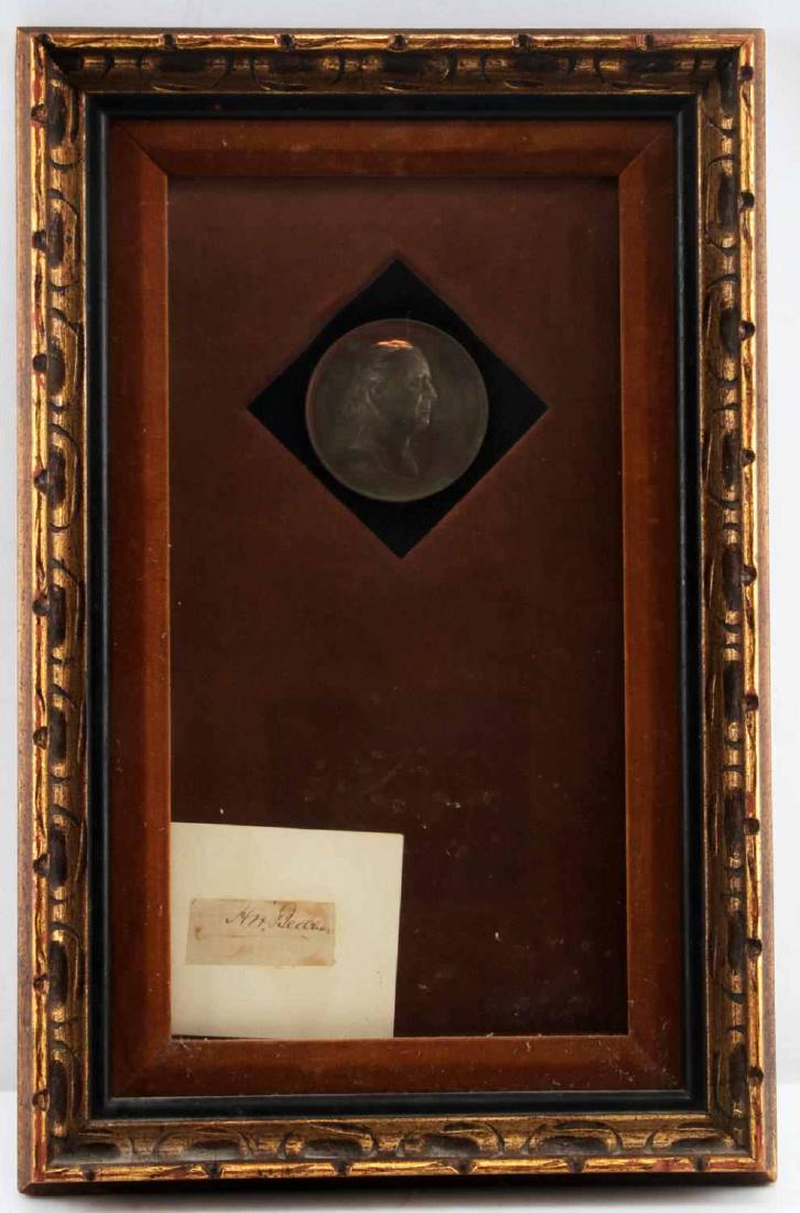 HENRY W BEECHER BRONZE MEDAL CLIPPED SIGNATURE: Framed Henry Ward Beecher 1887 bronze table medal with clipped autograph. Backed on brown velvet. 13.75 inches by 7 inches, sight. 18.5 inches by 12 inches, framed. Artifacts in excellent condition. F