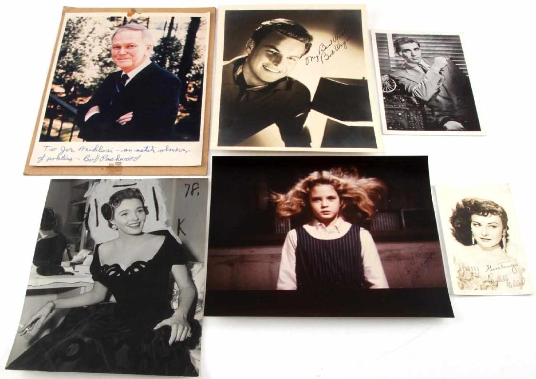 LOT OF VINTAGE MODERN HOLLYWOOD PHOTOGRAPHS SIGNED: Lot of autographed photos including Paulette Goddard, Steve Corbin, Bob Wagner, Drew Barrymore, Bob Packwood. One photo proof of Patricia Neal from 1952 used for news story. Newspaper story attached t