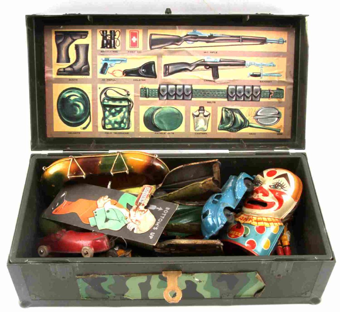 GI JOE FOOT LOCKER FULL OF ANTIQUE TIN TOYS: Includes the locker and J. Chein clown bank, Unique art K-9 pup working wind up tin toy, toy wood life raft , 1 metal and 2 hard rubber cars. G3