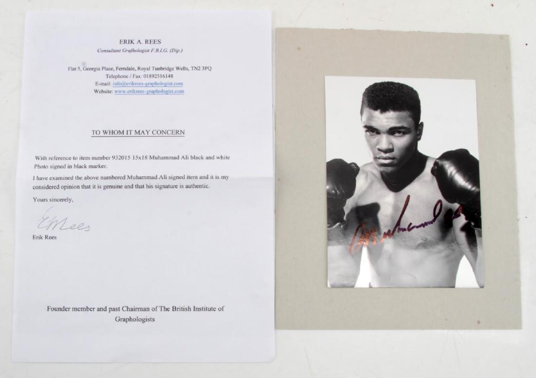 MUHAMMAD ALI CASSIUS CLAY AUTOGRAPH W COA: 5x7 black & white autographed photo of legendary heavyweight boxer Cassius Marcellus Clay Jr., better known as "Muhammad Ali". Hand signed in black marker. Not personalized. Includes signed COA . Very