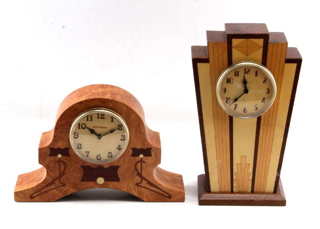 2 MWB STUDIOS MANTLE CLOCKS ART DECO WOOD INLAY: One Art Deco clock, battery operated, MWB Studios, stands 11.75 inches, and one wider wood clock, 11.25 inches long, MWB Studios, battery operated, both in very good condition, however, need batteries