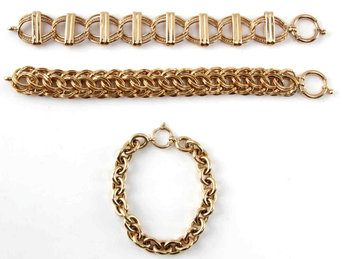 LOT OF 3 14KT YELLOW GOLD LINK BRACELETS TURKEY: 3 bracelets. The larger linked bracelet with bars down the center measures 7 1/8 inches, the second simple linked bracelet measures 7.5 inches long. The third is multi-linked and measures 7 3/8 inches