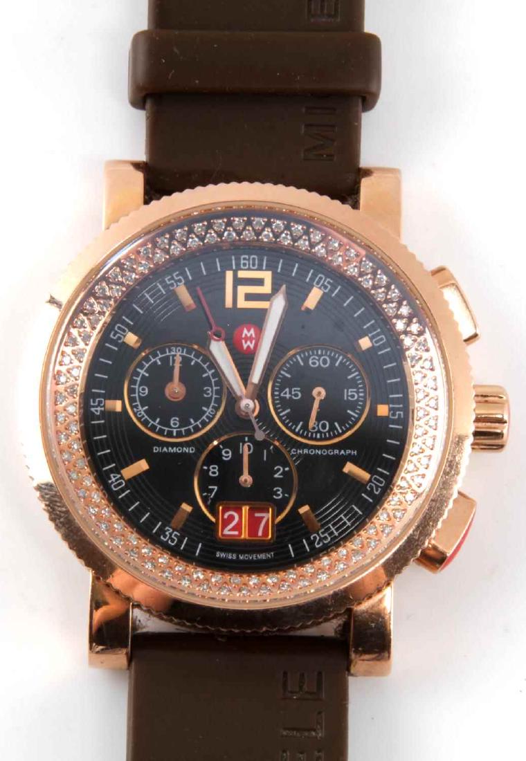 MICHELE DIAMOND CHRONOGRAPH WATCH .56 TCW: Model MW01K01G1002. Swiss movement. Rose gold stainless steel case with navy/black face with three displays. Small second hand is moving but two larger hands are not, probably needs battery. No scratc