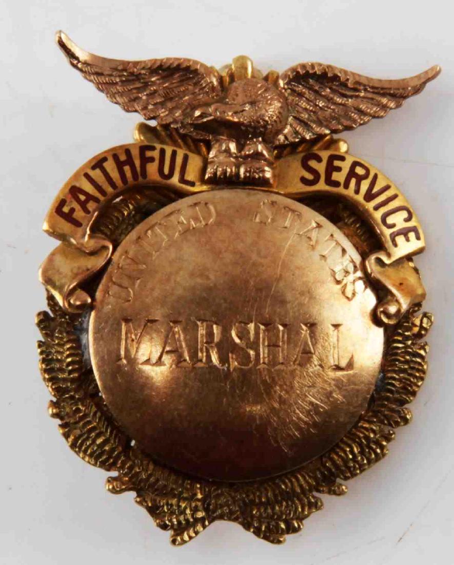 U.S. MARSHALL SERVICE 14KT GOLD SERVICE BADGE: Named reverse to Robert A. Dodson and stamped 14 KT at bottom, weighs 11 grams and measures 30mm. Very good original condition. RM55