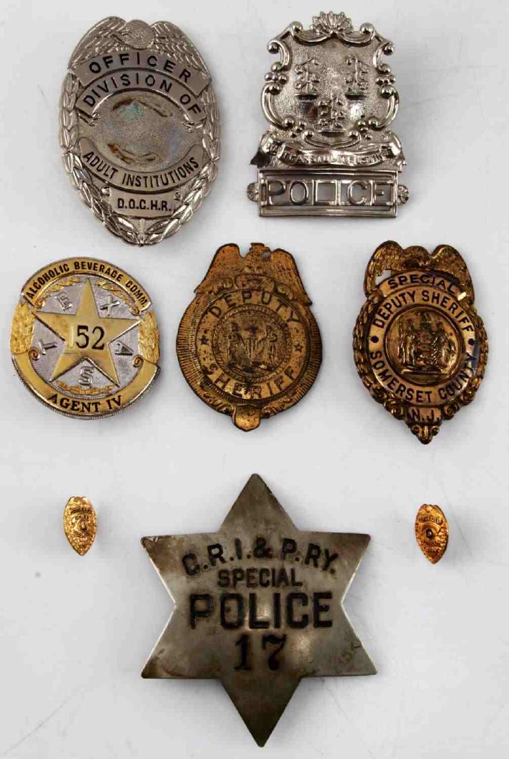 7 ANTIQUE POLICE BADGE LOT ROCK ISLAND ABC & MORE: Includes Rock Island Railroad Police very good, a child's play Deputy sheriff, Somerset County NJ, missing clasp, ABC Agent Texas, 2 miniature Chief badges and more size ranges from 16mm to 85mm. RM55