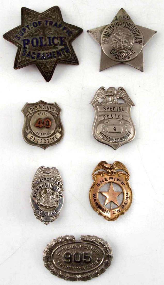 UNITED STATES OBSOLETE POLICE & SHERIFF BADGE LOT: Lot of seven obsolete police and sheriff badges. Includes Franklin Township police, Des Moines Detective, Bridgeport Special Police, Warren County Sheriff, Sacramento Police, Middlebury Special Police