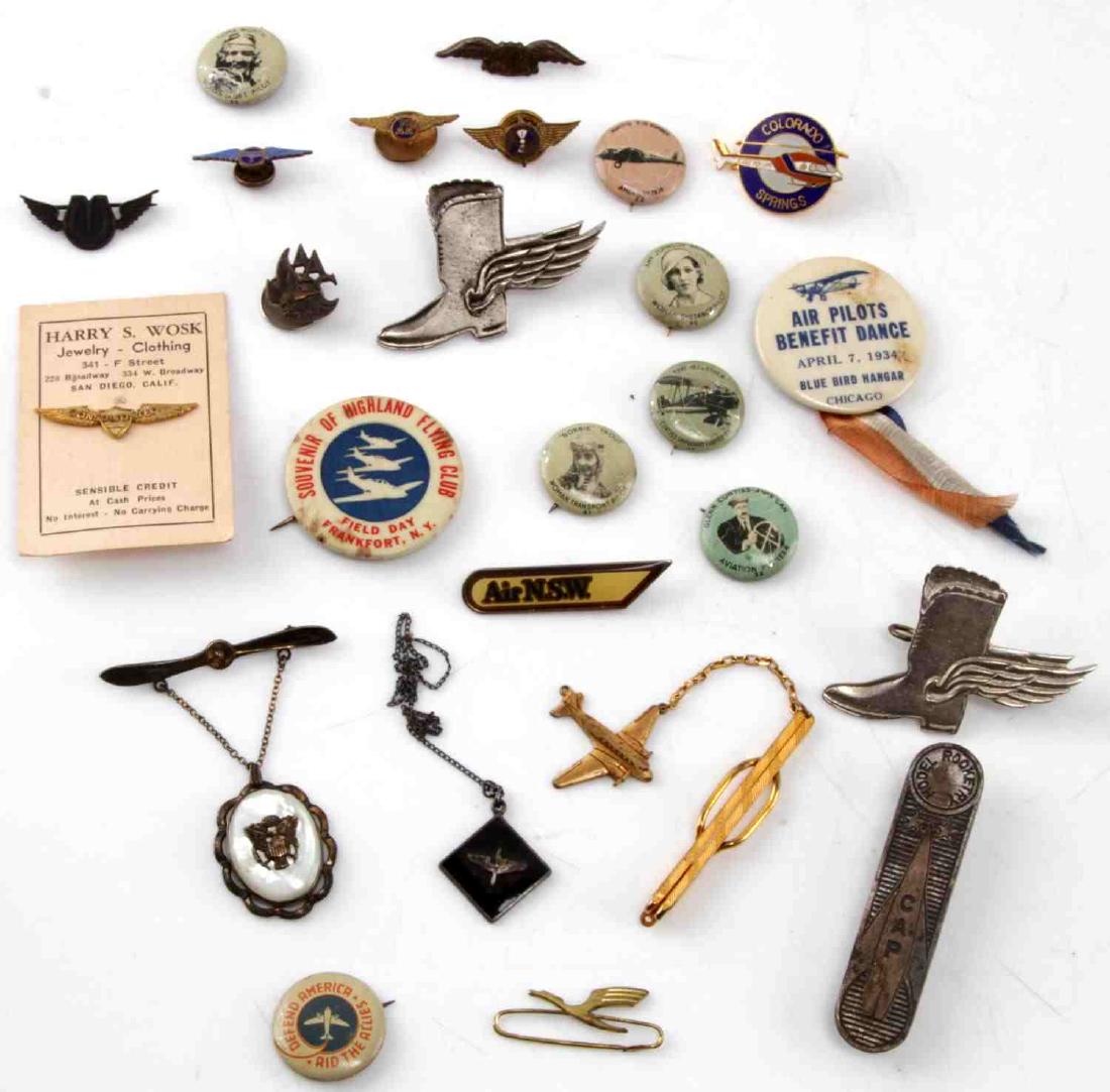 MILITARY & CIVILIAN AVIATION RELATED PINBACKS & BA: Includes 5 1917 pinbacks 4 of which are famous female aviators, 2 RAF winged boot badges, not silver and we can't authenticate but they appear as authentic as any seen, and others as pictured. NMRM15