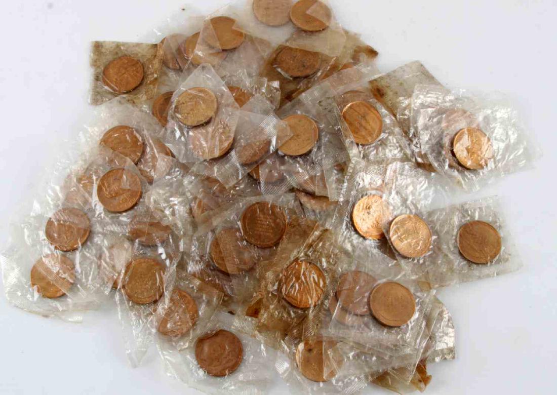 1969 APOLLO 11 MOONLANDING COMMEMORATIVE COIN LOT: Lot includes 97 1969 Apollo 11 commemorative coins. Sealed and in original condition.
