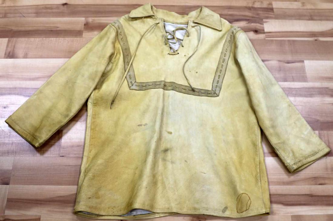 VINTAGE MOUNTAIN MAN FRONTIER JACKET REENACTOR: This is a rawhide frontier reenactors jacket with a 40" chest and measuring 27.5" in length. It is in good condition overall, however moderate staining is present. The interior of the jacket is in ver