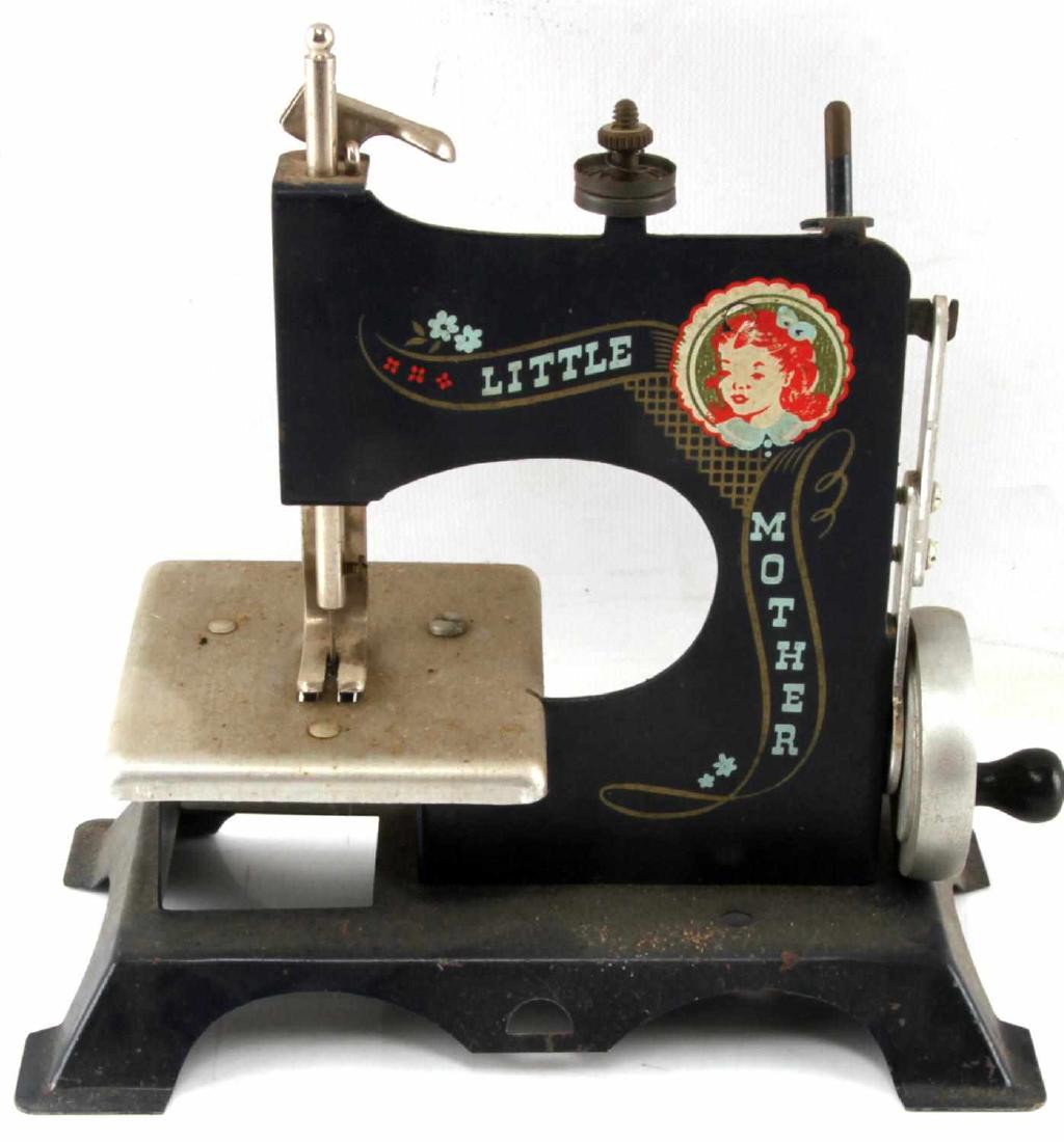 LITTLE MOTHER SEWING MACHINE WITH ORIGINAL BOX: Little Mother sewing machine with original box. Box has writing "Little Mother Sewing Machine M'F'D by artcraft metal products, inc. West Haven, Conn." on front and "Handle with care" on back. Machine