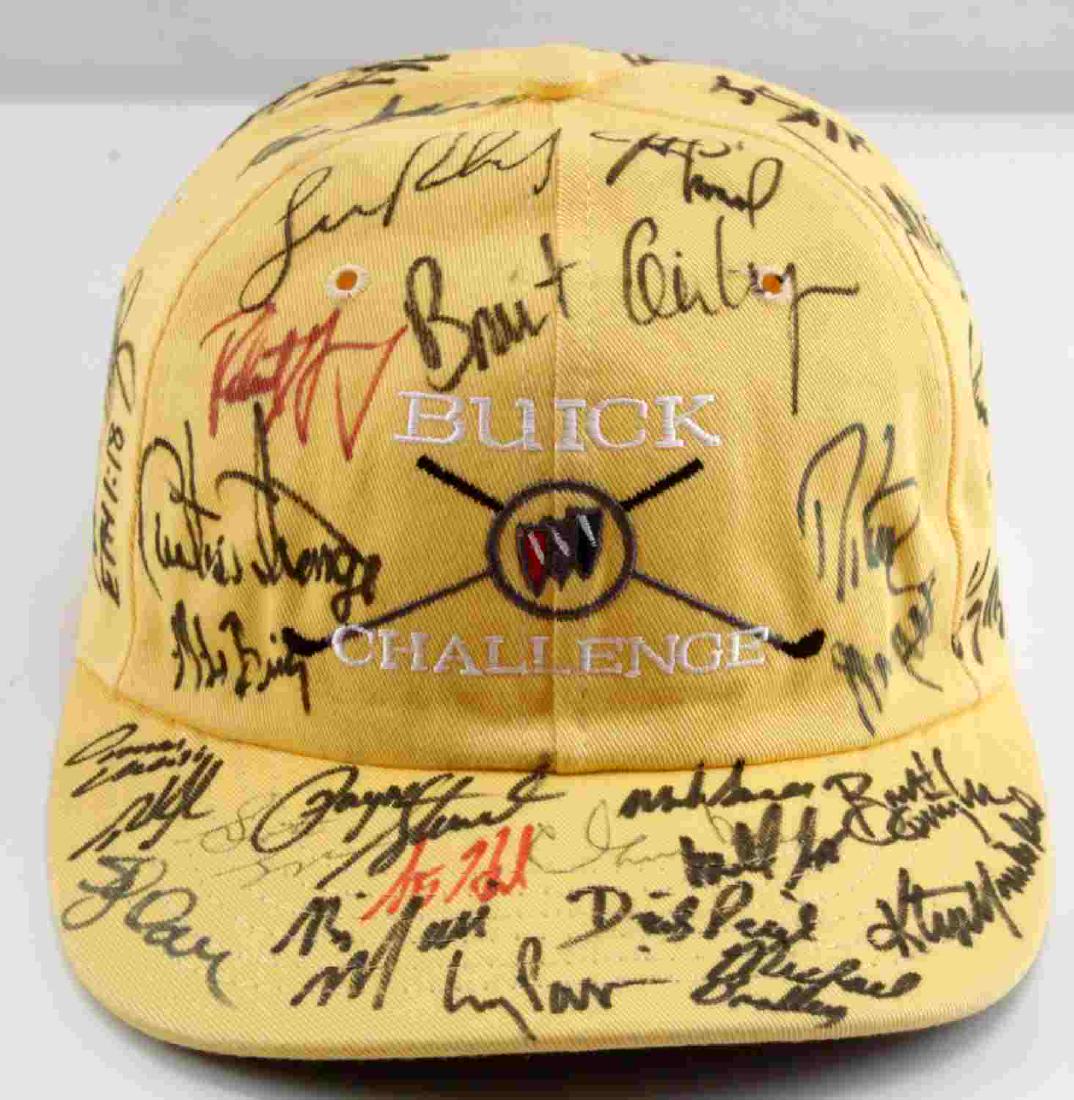 YELLOW BUICK CHALLENGE PAYNE STEWART SIGNED CAP: Yellow Buick Challenge hat signed by Payne Stewart plus 39 others, including John Daly, Davis Love III, Hal Sutton, Larry Mize, Tom Kite, and more. In very good condition, includes plastic protective