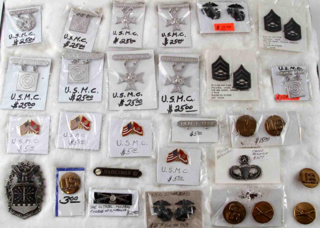 WWII & LATER UNITED STATES BADGE LOT OF 25: This lot features a variety of United States badges from WWII and later including many USMC proficiency badges, 1 Silver (tests positive) WWII USAF R.O.T.C badge, 1 Sterling WWII Marksman badge pin, U