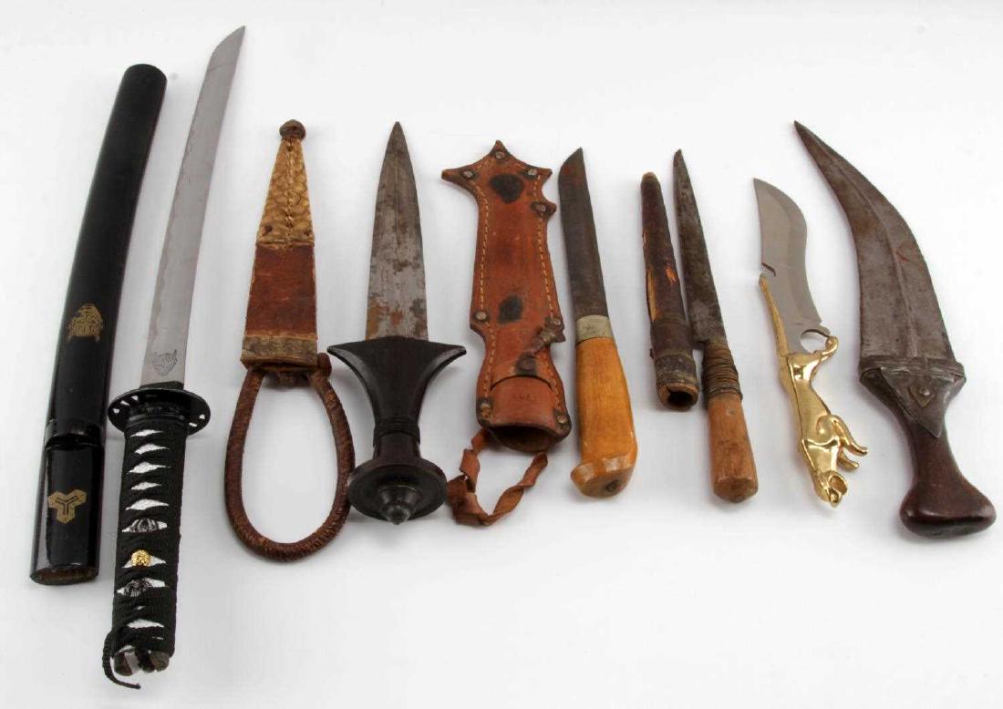 LOT OF 6 MIXED COUNTRY SHORT SWORD DAGGER LOT: Few Moroccan daggers, stainless steel with brass Jaguar as handle, Kill Bill replica short sword with devil emblem engraved to ricasso, one with curved blade. Longest is short sword measuring 19 inche