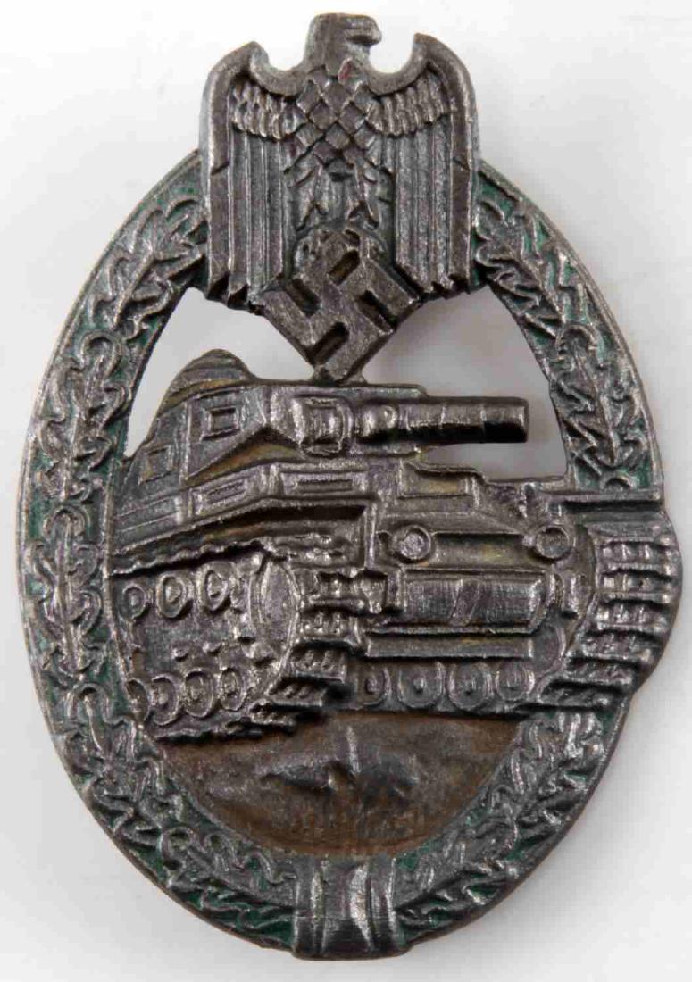 WWII GERMAN SILVER PANZER ASSAULT BADGE RS MAKER: WWII German Third Reich Silver Panzer Assault badge marked on the center of the obverse beneath vertical pinback which reads "R.S". Measures 2 inches wide by 2.5 inches in length. In good condition wi