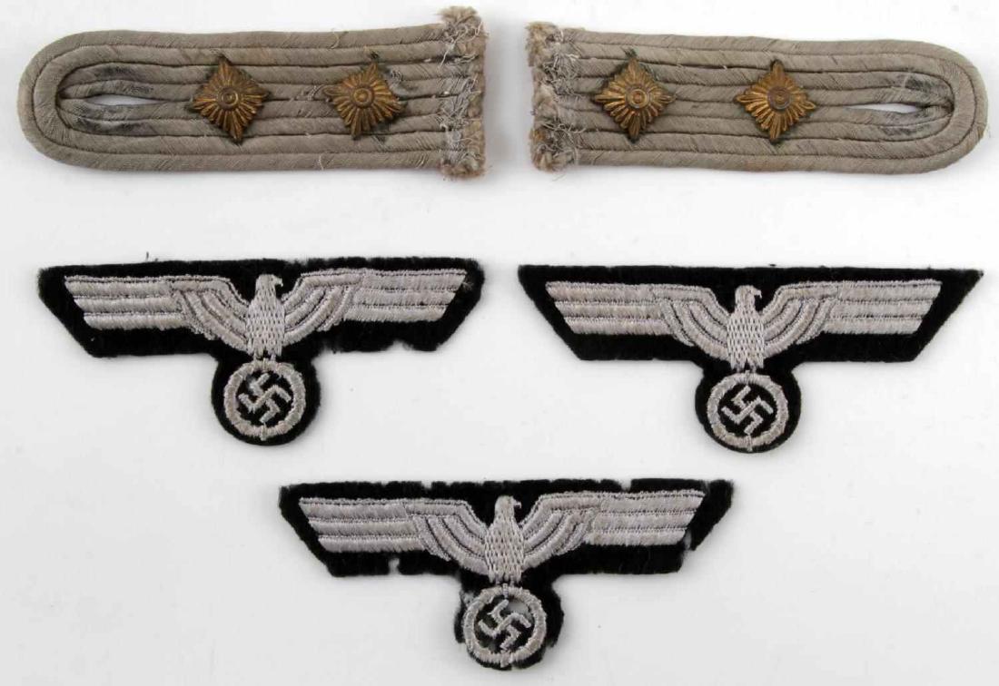 WWII GERMAN BREAST EAGLE & SHOULDER BOARD LOT OF 5: This lot includes 2 German Hauptmann (Captain) Shoulder boards and 3 1939 version Panzer division breast eagles. Items are in fair condition, however signs of use are present including moderate fabric