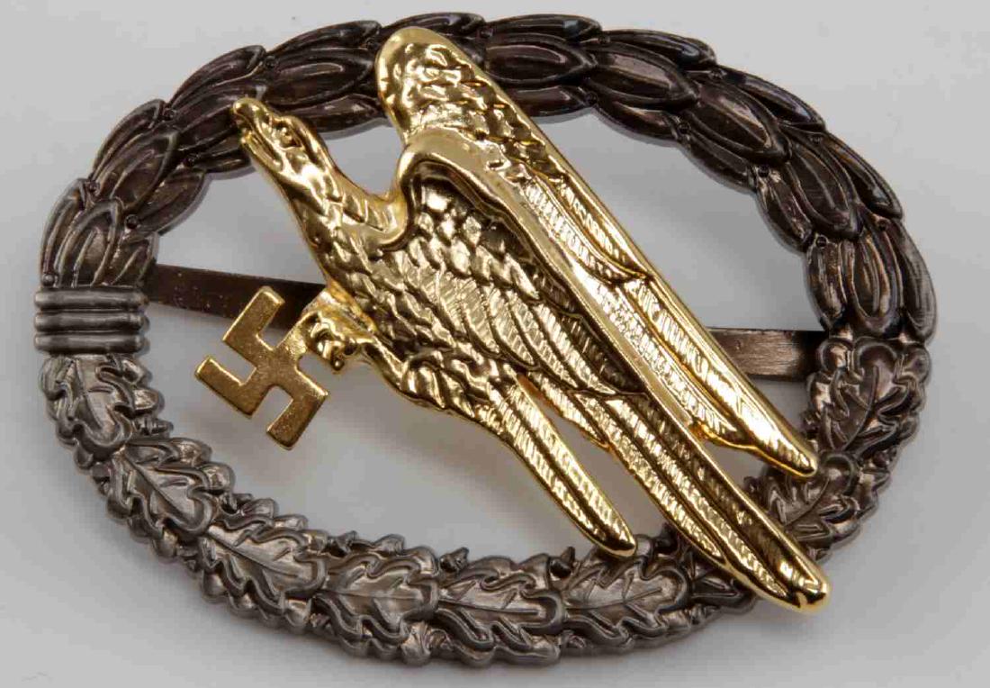 WWII GERMAN 3RD REICH LUFTWAFFE PARATROOPER BADGE: This is a reproduction Luftwaffe Paratrooper badge. It is marked C E Junker Berunsw69. It is well made and in near new condition.