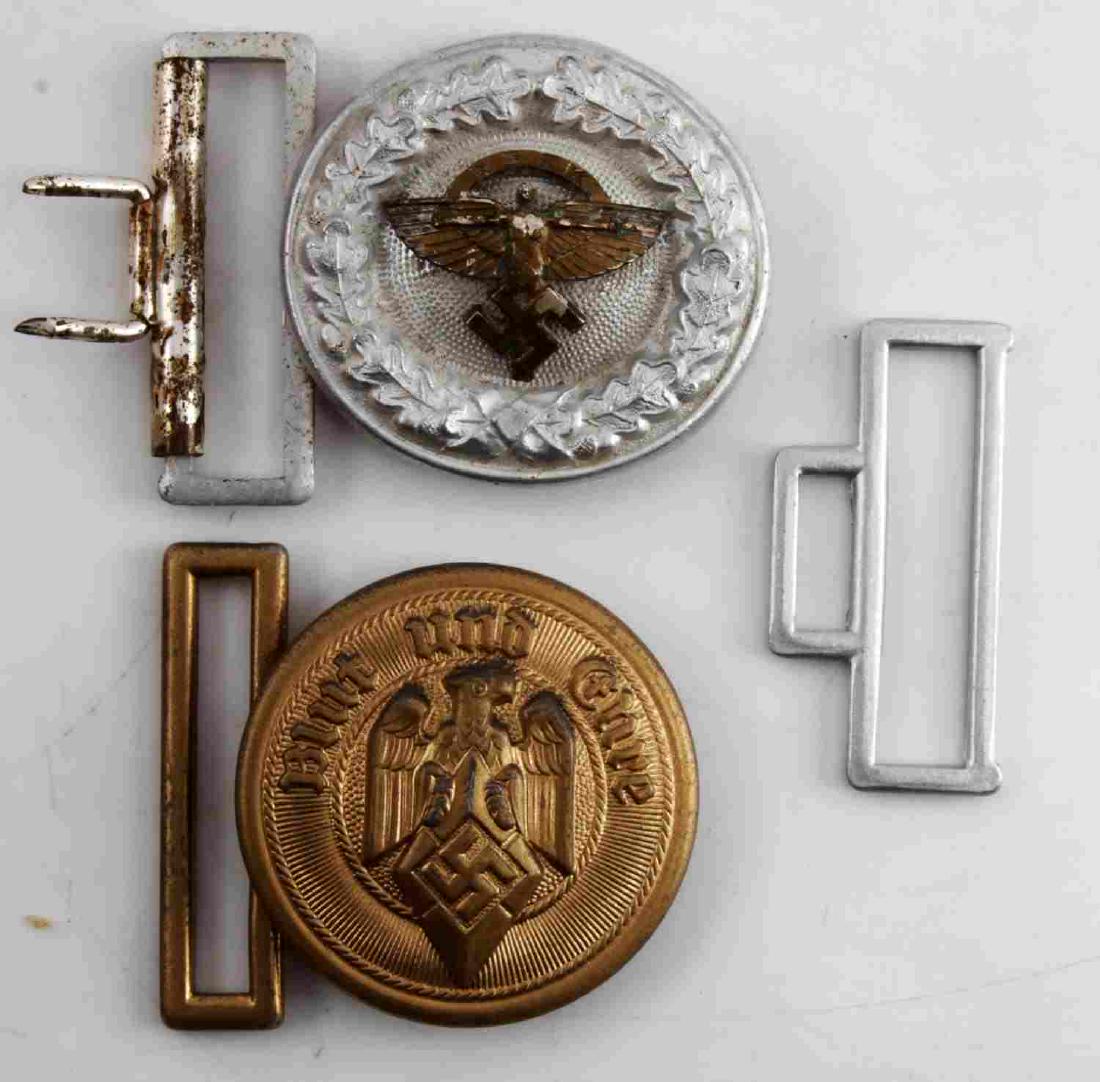 2 WWII GERMAN THIRD REICH NSDAP BELT BUCKLE LOT: Lot of TWO (2) - NSFK officer and Hitlerjugend leader. Maker's marks on the reverse of one. Some age wear. Unauthenticated. Sold "as is". This lot has a reserve.