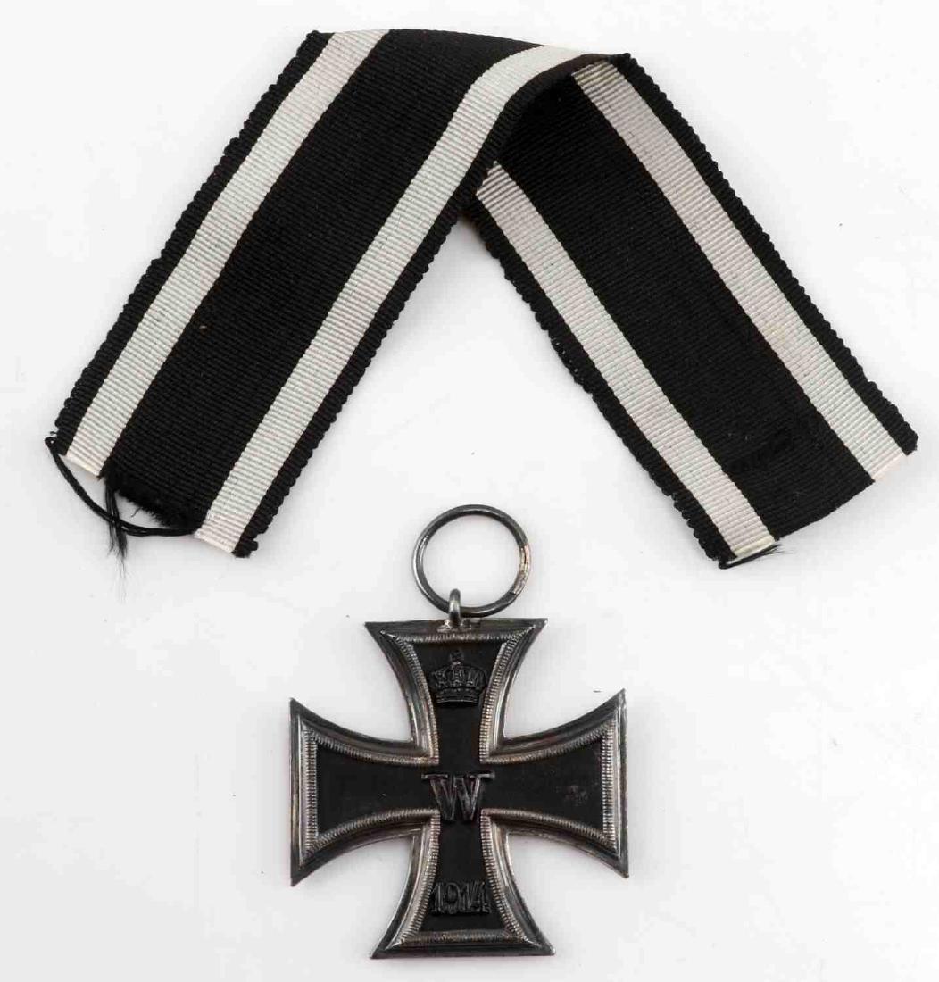 GERMAN IMPERIAL IRON CROSS OF 1914 SECOND CLASS: An Imperial German Iron Cross of 1914, second class. Crown with W and 1914 on front. Crown with FW and 1813 on back. Ring attached to top. Has ribbon. In very good condition. G3.