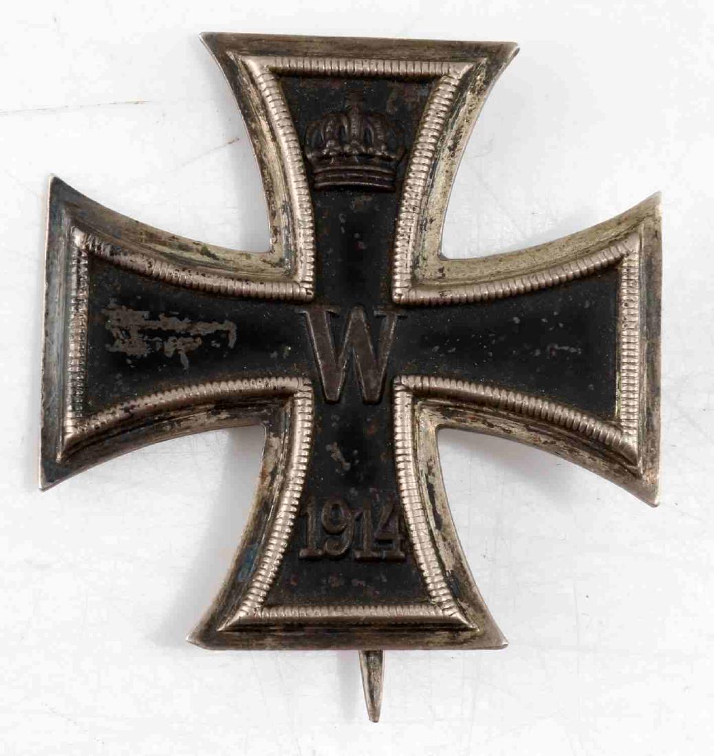 GERMAN IMPERIAL IRON CROSS OF 1914 FIRST CLASS: Imperial German Iron Cross of 1914, first class. Crown with W over 1914 on front. Marked KO on back. Stout pin with 90 degree lie. In very good condition with some slight discoloration. G3.