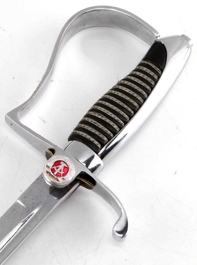 COLD WAR EAST GERMAN PARADE DRESS SWORD: East German NPA officer's dress sword. In very good condition with minor paint wear on the scabbard, otherwise near mint condition.