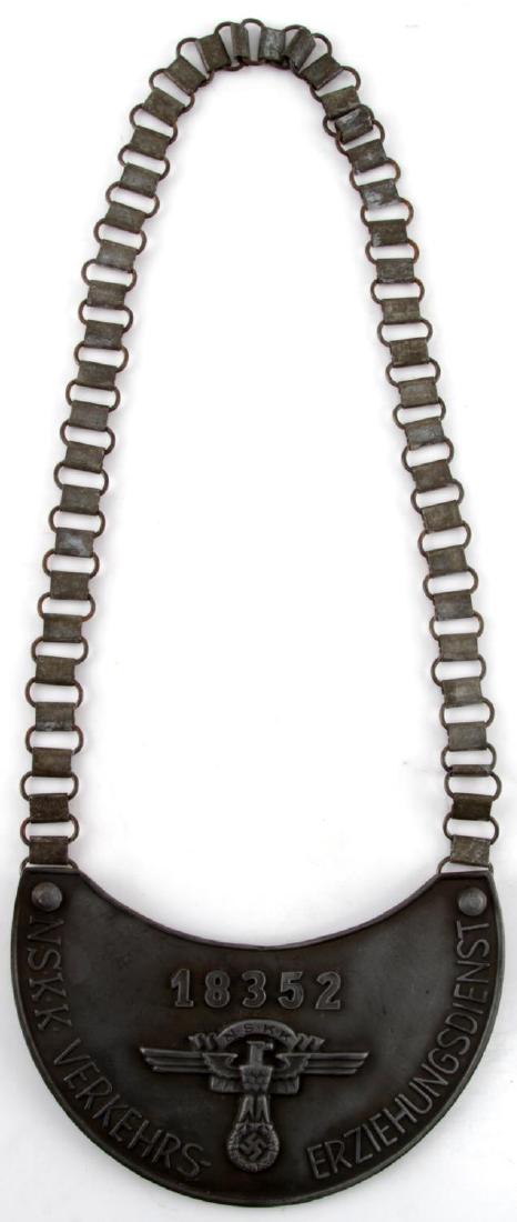WWII GERMAN THIRD REICH NSKK GORGET W HANGER: WWII German Third Reich Marked NSKK Gorget with chain hanger, gorget itself is solid metal and marked on the obverse with the circular RZM symbol, text as well as the numerical marking "M34/2". Item i