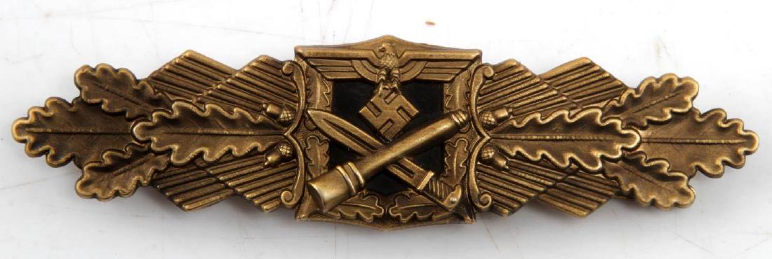 WWII GERMAN THIRD REICH GOLD CLOSE COMBAT CLASP: Superb craftsmanship magnetic core with stout pin and J hook. Reverse back marked to the left "FEC. W.E. Peekhaus Berlin." Marked "FLL" to the right. Very good condition, slight wear.