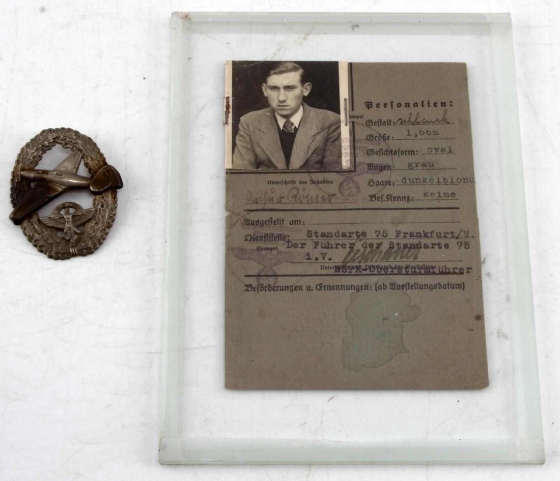 NSFK POWERED AIRCRAFT BADGE WITH AUSWEIS ID CARD: NSFK Powered aircraft pilot's badge with Ausweis ID card of the Powered Aircraft NSSFK Pilot with photo and filled out fields in both typewriter and handwritten German, the NSFK badge and Ausweis ID c