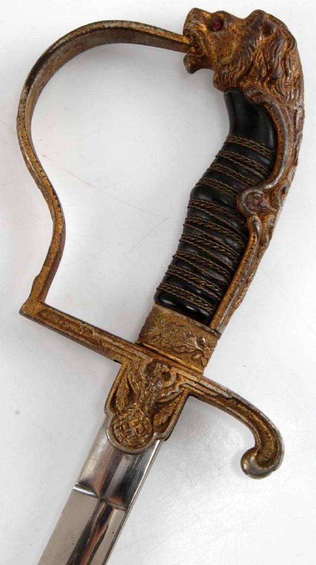 WWII GERMAN THIRD REICH LIONSHEAD OFFICER SWORD: This is a WWII German officer's Lions Head officer's sword. It is marked "ALCOSO AC Solingen" on its ricasso and is in good condition. Slight edge abrasions are present and its handle has lost some of