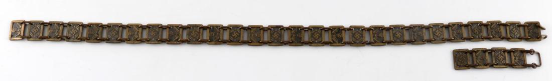 WWII GERMAN 3RD REICH STANDARD BEARER GORGET CHAIN: NSDAP gorget chain. Thirty-one 5/8" x 13/16" bronzed panels, bearing alternating Reichsadler/swastika and swastika/oak leaf motifs, joined with chain links. End links are marked "RZM M 1/17" and have