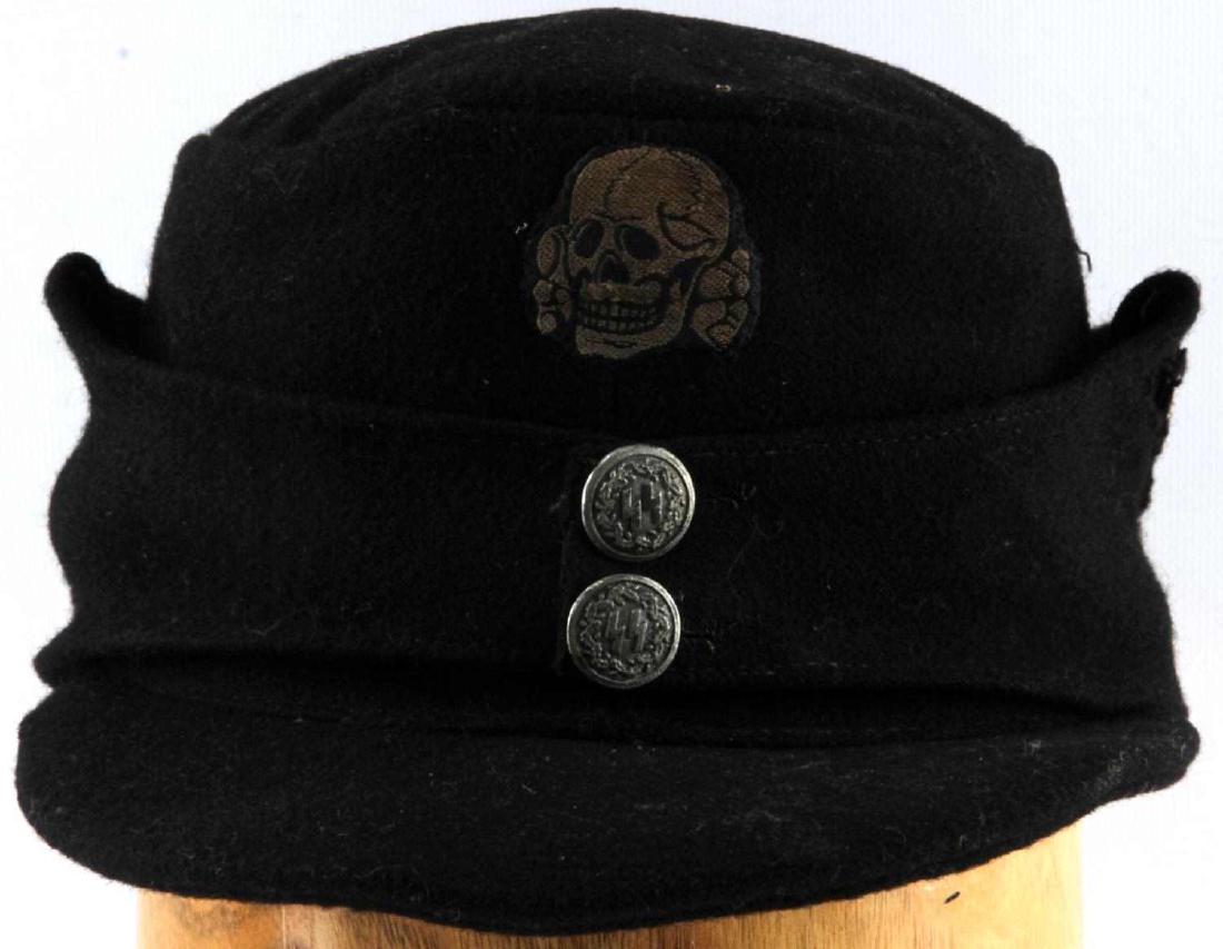 WWII GERMAN 3RD REICH WAFFEN SS PANZER EM M43 CAP: Black wool Panzer M43 cap. Has Totenkopf patch on the front and Reichsadler on the left side. Both buttons have SS sig runes surrounded by a wreath. The Reichsadler patch seems smaller and of a differ