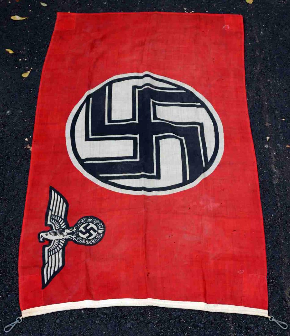 WWII GERMAN LUFTWAFFE PILOT SCHOOL FLAG: This is a WWII Luftwaffe school flag with centered swastika and Reichsadler in upper left corner. It measures 59" L X 30" W. It is in good condition overall with some slight staining and color loss pr
