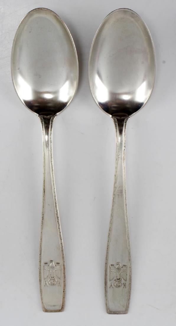WWII HITLER THIRD REICH HALLMARK 800 SILVERWARE: This lot features 2 800 silver hallmarked Adolf Hitler spoons from his personal formal dinnerware set. The spoons feature his "A H" Eagle/wreath/swastika hallmark and test positive for silver. These c