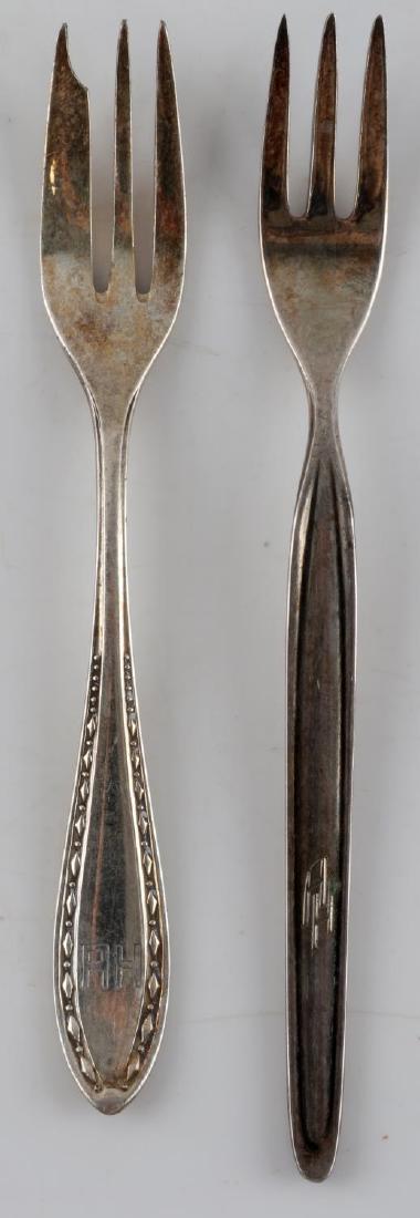 WWII GERMAN ADOLF HITLER PERSONAL SILVERWARE LOT: This lot features 2 Adolf Hitler "A H" monogrammed forks from his personal collection. 1 reverse is stamped Wellner 100 with elephant. The other is marked WMF 90-18. They are 6" and just under 5.75" i