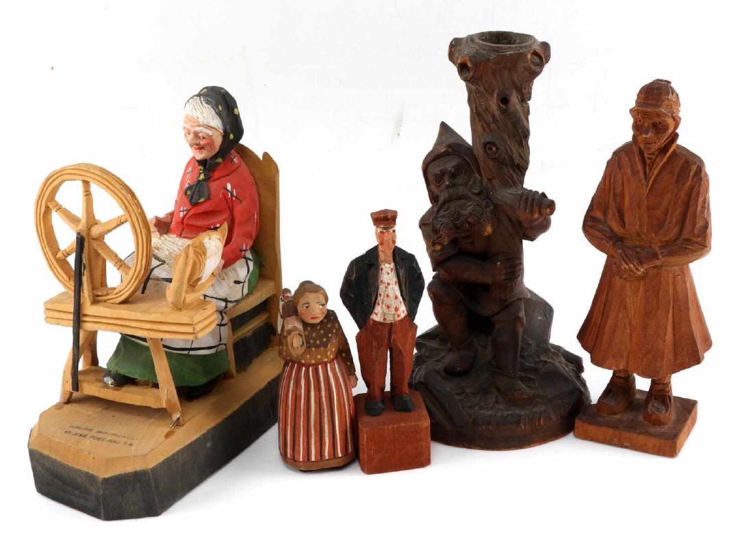 LOT OF CARVED WOODEN FIGURES ANDRE BOURGAULT: Lot of carved wooden figures. One Andre Bourgault woman sitting and spinning carved figure. Spinning wheel has been reglued to base. Measures approximately 6 inches by 6.5 inches. One gnome holding on