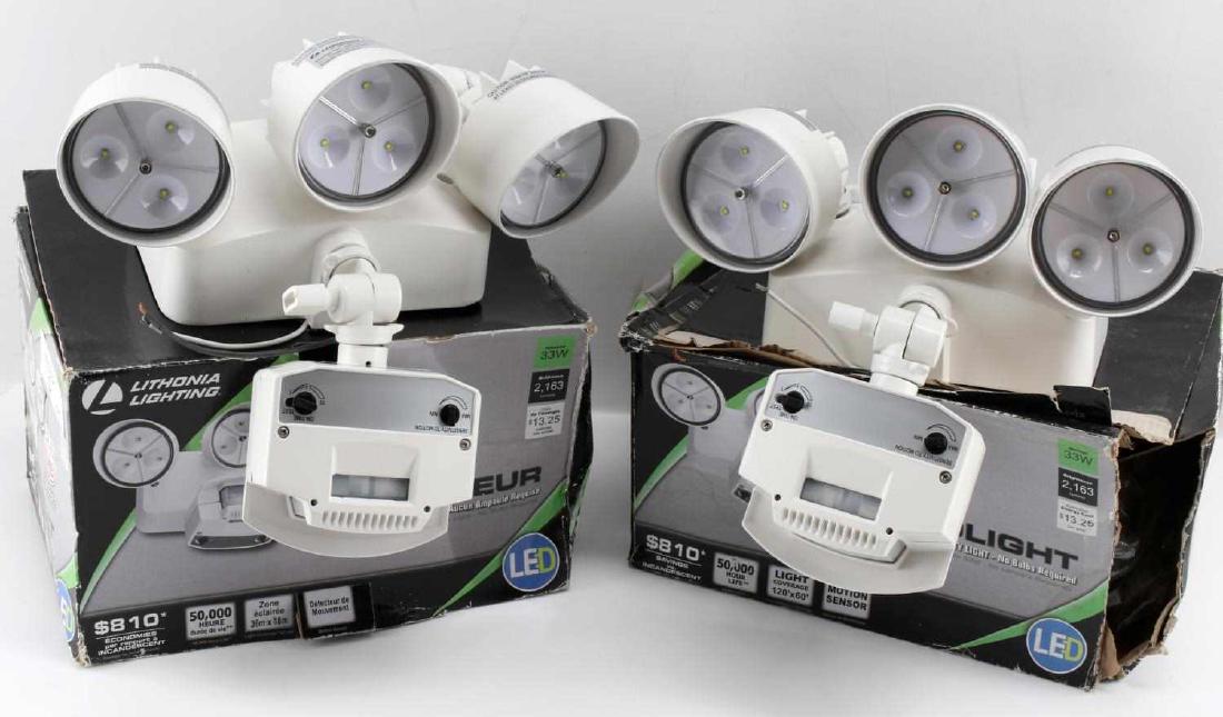 2 LITHONIA LIGHTING LED PROJECTEURS 180 DEGREES: Two flood lights in box. 33W 3-head Integrated LED Security Light with motion sensor. No bulbs required. Boxes have wear.