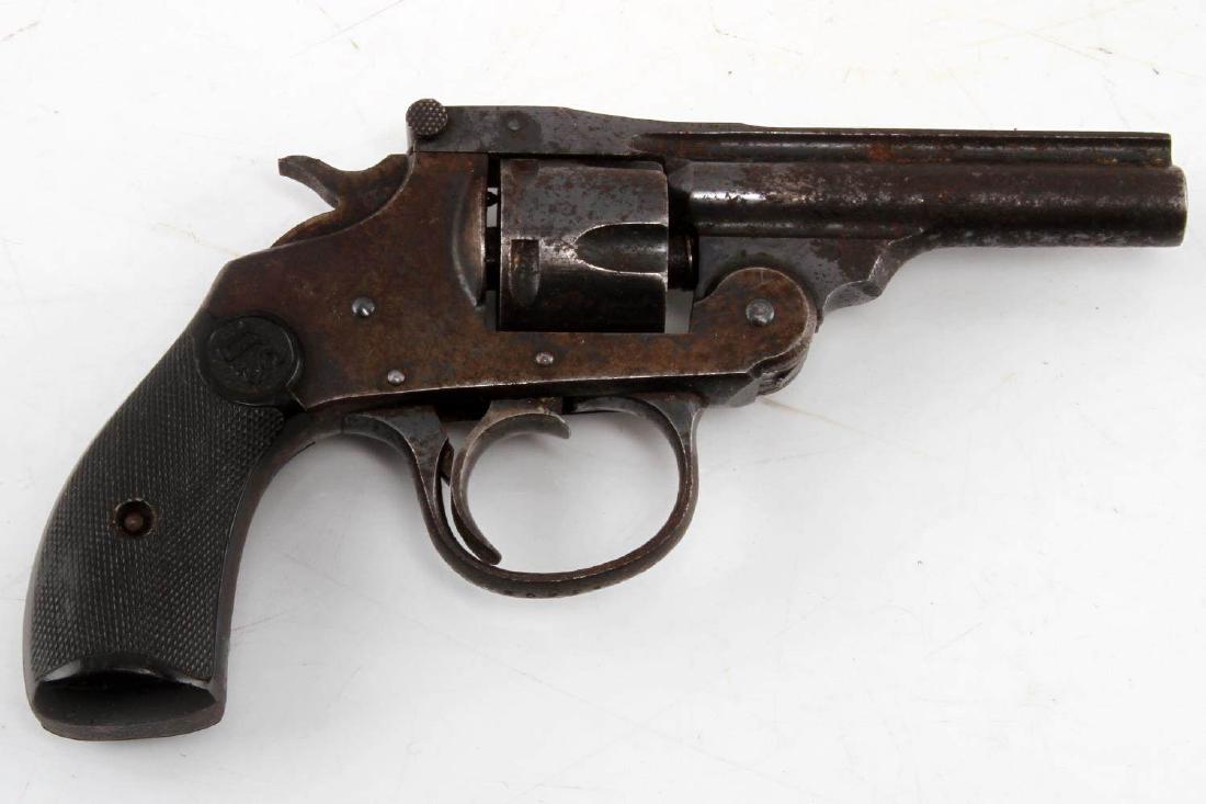 ANTIQUE US TOP BREAK 5 SHOT REVOLVER 32 CALIBER: Maker marked to top rib, 3 inch round barrel with pitted bore, heavily rusted, bakelite US grips, serial no. marked to guard, missing front sight, action is a little sticky but functional. Requires FF