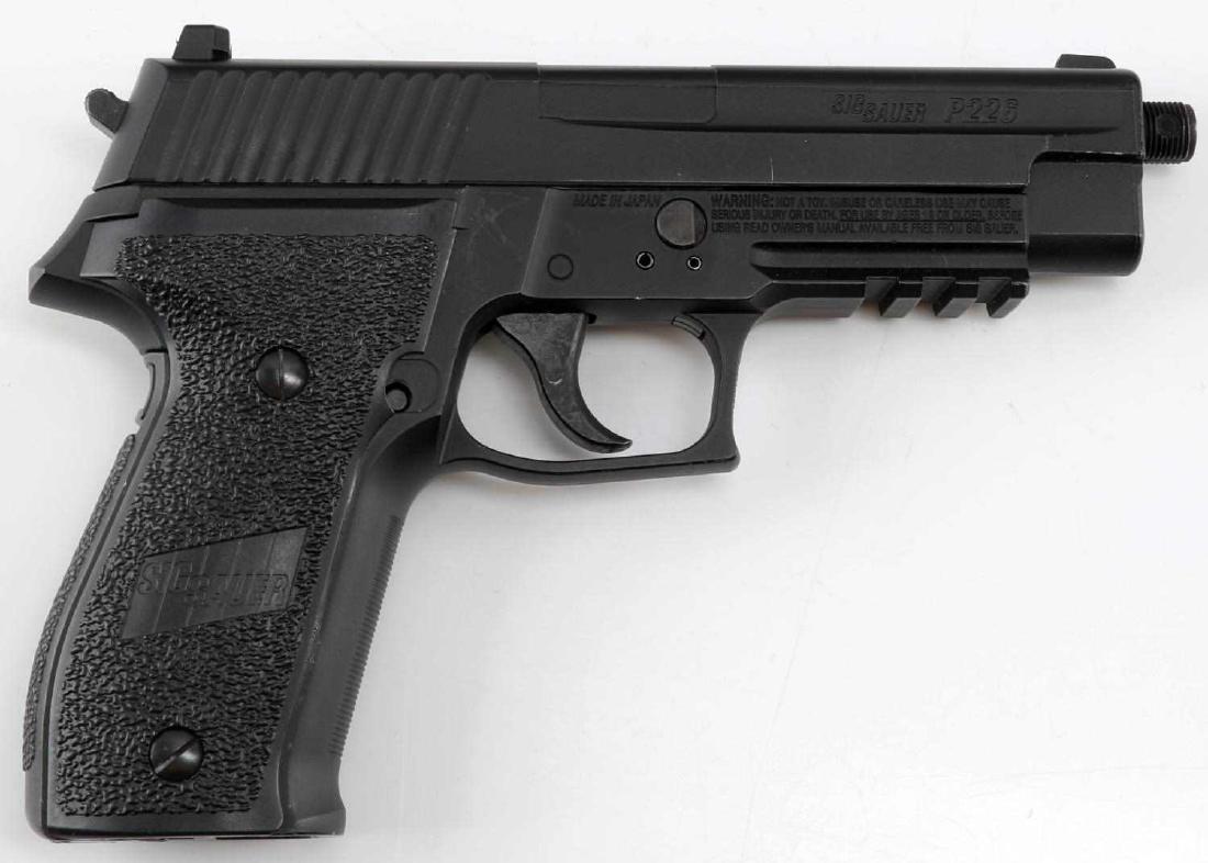 SIG SAUER P226 AIR PISTOL .177 CAL W CO2 AND CASE: All black air pistol, maker marked to both sides. Comes with two CO2 cartridges in hard case. Gun measures 8.5 inches long. Caliber: .177 Serial #: 17H67192
