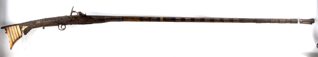 MOROCCAN CURTIS BERBER BELGIAN RIFLE MUSKET .36: Early 19th century Moroccan musket. About .36 caliber. Iron furniture, bone rear stock, red and blue lacquer and brass fittings. "Curtis" marked to left barrel flat. Belgian mark "ELG" to top barrel f