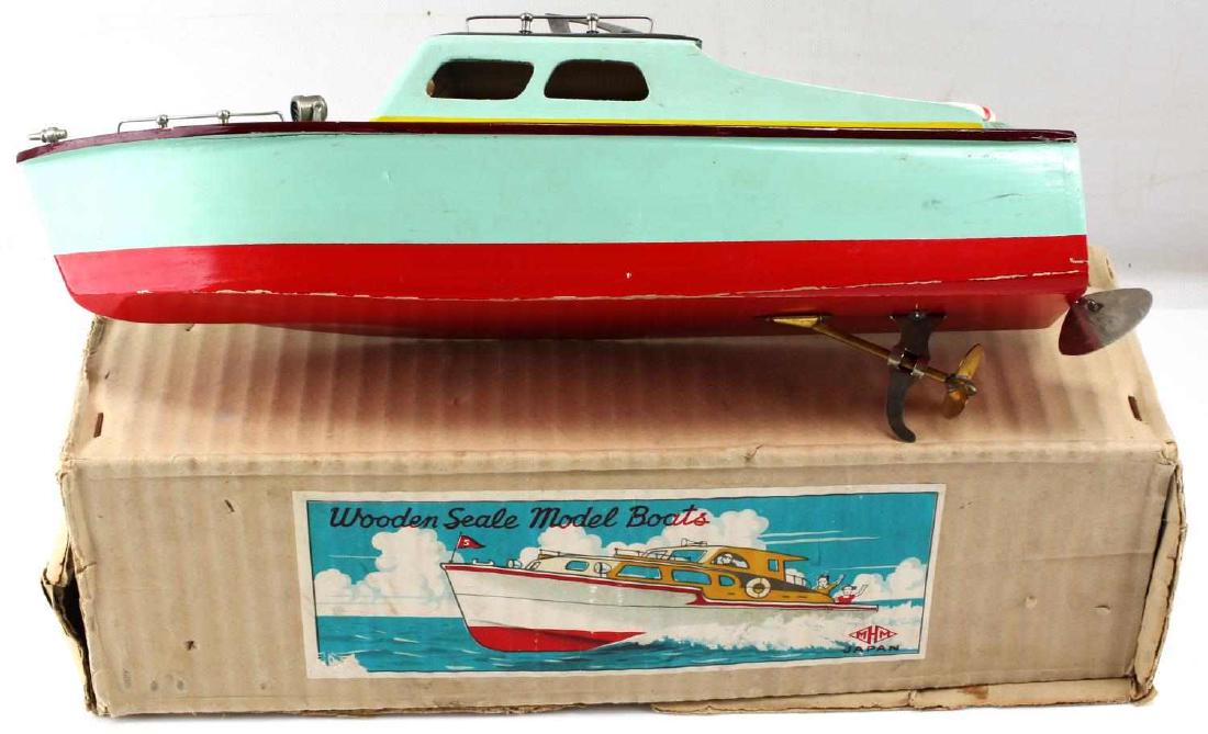 VINTAGE 1950'S MHM JAPAN WOOD BATTERY SPEEDBOAT: MHM made battery powered wooden inboard speedboat. Comes in original box and is in very good condition. Brass propeller with aluminum fixtures and rudder.