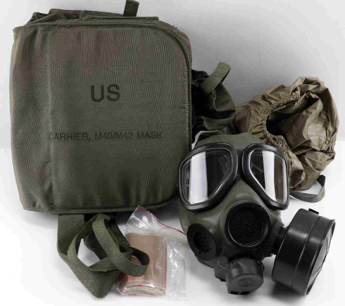M40 M42 BIOLOGICAL CHEMICAL MASK CANISTER LOT OF 3: This lot includes 1 M40/42 bio mask with carrier and 2 ASZM-TEDA C2A1 mask canisters. All are in near new to new condition. Canisters are unopened.